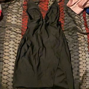 Black mini dress with high slit and open back
